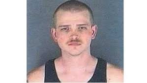 Kansas man accused of killing police officer dies in prison