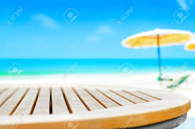 The top of the table folds flat and has an open top for easy access. Round Wood Table Top On Blur Beach Background Can Be Used For Stock Photo Picture And Royalty Free Image Image 42675245