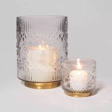 They are made of carved wood and covered with gold paint. Cozy White Decor Inspiring Winter Neutrals To Get The Look Hello Lovely Hurricane Candle Holders Candle Holders Glass Hurricane Candle Holder