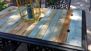 Took The Glass Top Out Of A Patio Table And Replaced With Stained Cedar Boards Added Some Metal Hinges And Handles Patio Table Redo Diy Patio Patio Table Top