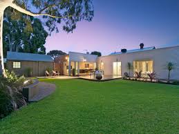 Backyard Spaced Interior Design Ideas Photos And Pictures For Australian Homes The low stucco wall helps to further define the space along with all of the drought tolerant landscaping.