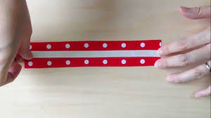 Firstly, print out two pictures of the singapore flag emblem. Singapore National Day Ribbon Bracelet Crafts Kit For Kids Ndp 2012 Kasey Crafts