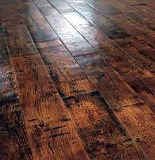 Carlisle's rustic flooring is a genuine antique and comes with a handmade commemorative portfolio, personalized with a complete history of where the floor came from and how it was procured. Dark Rustic Wood Flooring Also Many Other Flooring Choices On This Link Recuperando Rustic Wood Floors Rustic Flooring Flooring