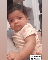 Our little angel is growing up fast! Born as a 4.11 pound premie we can  remember when she fit in the palm of our hand. Now she is a beautiful 13  pounder