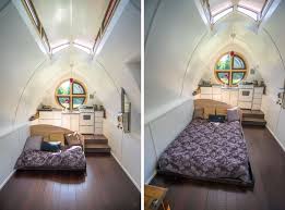 Tiny house with elevated loft area and wood exterior on wheels. Tiny House Bed Options