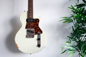 I have seen some of my friends creatively displaying guitars on their walls like a priced possession. How To Hang Your Guitars On The Wall Properly Guitar Com