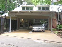 The carport has a concrete pad, a wooden fence on the side and a wooden underside. Model For Carport Landscape Design
