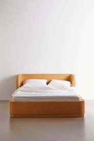 The large footprint and bold design of the decorative headboard makes a statement. Amaia Bed Urban Outfitters Upholstered Bed Frame Upholstered Beds Wingback Headboard