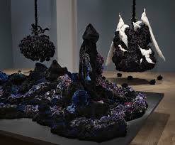 For a sleek nautical look, use rope to hang a round mirror. Petah Coyne Art At A Time Like This