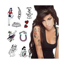 Amy's tattoos are very interesting both for their visual appeal and because they tell us so much about her short, but massively significant life. Amy Winehouse Amy Winehouse Amy Winehouse Style Rock Tattoo