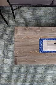 This fire pit table's rectangular silhouette is made from concrete and features a glass flame guard that adds contemporary style to your outdoor arrangement. How To Build A Diy Fire Pit Table For 120 Crafted By The Hunts