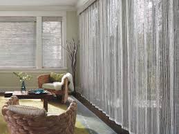 While it is nice to view using drapery panels for sliding glass doors. Provenance Woven Wood Vertical Drapery On A Sliding Glass Door For Sale At Blind Ambitions Window Treatments Living Room Woven Wood Shades Living Room Blinds