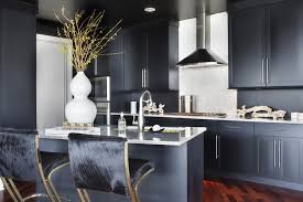 Anchored by a navy hexagon tile backsplash, this open kitchen serves up a fresh take on blue and white. Navy Blue Cabinets Contemporary Kitchen Lonny Magazine