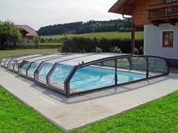 Swimming Pool Eclosure Oceanic Low With Classic House In The Background In 2020 Pool Cover Pool Retractable Pool Cover