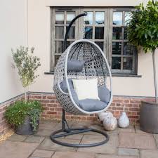 This swinging loveseat is basically the dream garden seating set up. Ascot Hanging Chair With Weatherproof Cushions Outdoor Living From Breeze Furniture Uk