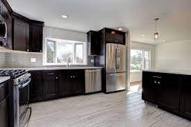 Countertops and full height backsplash are taj mahal quartzite. 249 Coldbrook Ct Stainless Steel Appliances Cherry Cabinets Grey Glass Backsplash Cherry Cabinets Kitchen Contemporary Kitchen Backsplash Cherry Cabinets