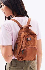Made of corduroy with a main compartment and front accessory pocket, finished with zip closures, web haul loop and adjustable shoulder straps. Dickies Camel Corduroy Mini Backpack Pacsun