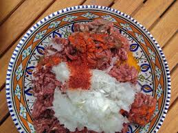 This dense paste is then decorated with slivered almonds and. Kabab Tabei Persian Beef Patties In Tomato Sauce With Sumac Rice Iranian Dishes Beef Patty Dinner