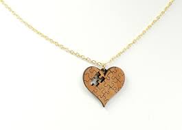 Each necklace comes in a bag. Autism Puzzle Pendant Necklace Whimsy Gift Shop