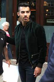 Joe Jonas Just Wore Two Of Fall S Biggest Trends At The Same Time Velvet Bomber Jacket Velvet Bomber Bomber Jacket