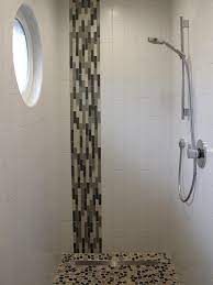 Black hex border tiles bring an accent ing touch around white hex bathroom floor tiles around a drop in bathtub. Contemporary Shower With Gray And White Glass Tile Stripe Bathroom Shower Design Glass Tile Shower Bathroom Shower Walls