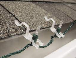 Then, you would secure the light strand into place, arranging your lights so that they hang in a way that they outline your roof's drip edge. Christmas Light Clips Guide