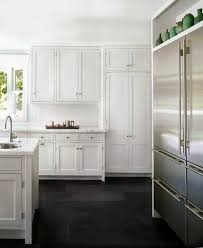 Carlson Sought To Keep The Palette Simple She Used A Black Slate Floor Which Provides Contrast With Wood Floor Kitchen Classic White Kitchen Kitchen Interior