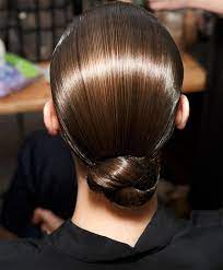 After that, twist the braid on the smaller side to make it a bun and then clip it. Wet Look Simple Bun For Prom Full Dose Hair Styles 2014 Hair Styles Runway Hair