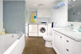 Wood and white are a great combination for this type of room design, it looks. 14 Multifunctional Bathroom Designs With Laundry Space Laundry Room Bathroom Laundry Bathroom Combo Laundry In Bathroom