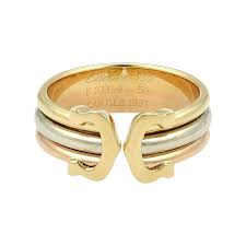 Maybe you would like to learn more about one of these? Cartier Cartier 18k Tri Color Gold Trinity Double C Logo Ring Truefacet Logo Ring Tri Color Ring Cartier Ring