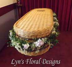Wicker coffin flower garlands are one of the most beautiful of all funeral arrangements, flowers adorn the casket which makes it a little more bearable to see when having to say goodbye to loved ones. Wicker Casket Garlands Lyn S Floral Designs Florist In Maidstone Kent Maidstone Kent
