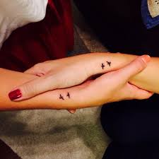 A lot of couples get matching tattoos. Matching Birds Tattoo Parryz Com