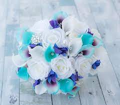 Check out this wedding flower checklist for all the other times you if so, we suggest asking your wedding florist to include a few extra flowers and pieces of greenery with your arrangements—your photographer will. This Is A Beautiful Almost Fresh Aqua Turquoise Teal Mix Calla Lilies White Roses And Blue Wedding Colors Purple Purple Wedding Theme Beach Wedding Bouquets