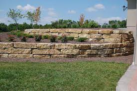 The recon concrete blocks for retaining walls are made from wet cast concrete specifically. Tiered 14 Ledgerock Limestone Retaining Walls Traditional Landscape Other By Topeka Landscape Inc Houzz