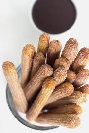 Baked Churros These Baked Churros Are Just As Good As Any Fried Churro It Has A Crunchy Exterior That S Been Rolled In Churros Recipe Baked Churros Recipes