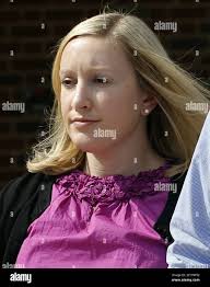 Jennifer Wiley Thompson, center, leaves the courtroom after she made an  appearance in an Orange County courtroom in Hillsborough, North Carolina,  Thursday, October 3, 2013. The former UNC tutor who worked with