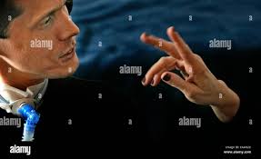 JIM GEHRZ * jgehrz@startribune.com Christopher Harmon, 35, concentrates  while communicating with sign language interpreter Rhonda Schaefer. Despite  suffering from a rare, neurological condition (called spino cerebellar  degeneration) which has left him ...