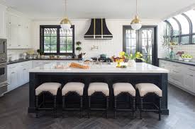 The cabinet hardware and barstools add extra dashes of black. No Gray Area How To Slay The Black And White Home Decor Trend