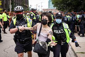 Three police officers suffered minor injuries, and one man was charged with assaulting an officer. 8qksy1rvbf5v2m