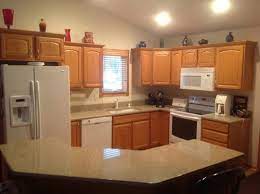 Black granite and white marble or quartz countertops go very well with oak cabinets. Kitchen Cabinets Leave Honey Oak Or Paint White Mocked Up Photo Included