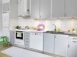 This kitchen features grey perimeter cabinetry (with amazing chef's kitchen style appliances), and the island is planked in white. Reader Request White Kitchen Appliances