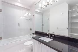 River white granite with white cabinets, white carrara marble backsplash and white ceramic arabesque tiles and costen floor. Black White Grey Granite Countertops Bathroom Ideas Houzz