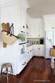 Savvy Southern Style The Kitchen Reveal Take Two Santos Mahogany Floor White Cabinets Trimmed Interior Design Kitchen Mahogany Kitchen Wood Floor Kitchen