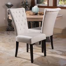 Sophisticated dining room with gray walls features a round wood antique dining table, white and heather gray french dining chairs with silver nailhead trim atop a white rug, white and pink abstract art over a gold leaf bar cart, window with. 18 Dining Chairs Tufted And Nailheads Ideas Dining Chairs Dining Chair