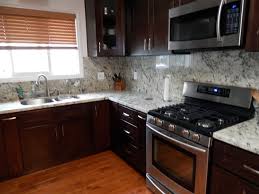 Solid wood, full overlay the solidity and synchronization that these espresso shaker cabinets emit, makes them a traditional yet efficient choice for today's kitchen cabinetry profiles. Espresso Kitchen Cabinets Wood Floor Contemporary Kitchen Los Angeles By Construction Guaranteed Houzz