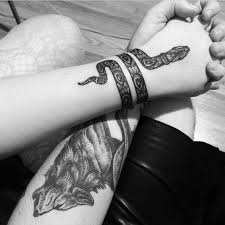 Whether this is a good idea for your tattoo will depend on the design you've chosen. Unique Black Ink Rattlesnake Tattoo On Left Wrist