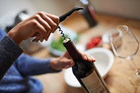 Red and white fermented grape beverages are poured into two sparkling glasses. How To Open A Wine Bottle With Or Without A Corkscrew