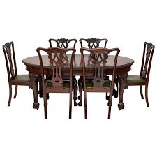 As we know that a just fold the lids (in the middle of the wooden table) down to get a flat surface that serves as a dining table for six individuals. Antique Mahogany Chippendale Style Dining Table And Six Chairs At 1stdibs