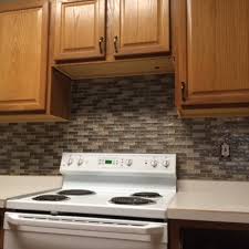 You can simply stick it over your hideous backsplash for a year or two, and pull it up when it's time to go! Easy Kitchen Mosaic Tile Backsplash Project Dengarden