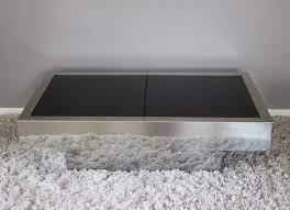 Durable tempered glass table top with stylish black frame around the edge. Black Glass Chrome Willy Rizzo Coffee Table With Hidden Bar 1970s 86248